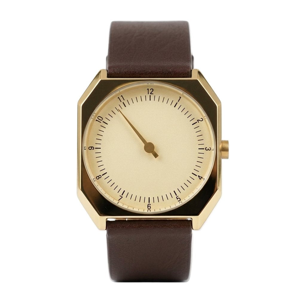 Relógio Masculino Rettrato 38mm Dourado, com caixa dourada, mostrador creme, ponteiro único e pulseira marrom fechada, em vista frontal sobre fundo branco.