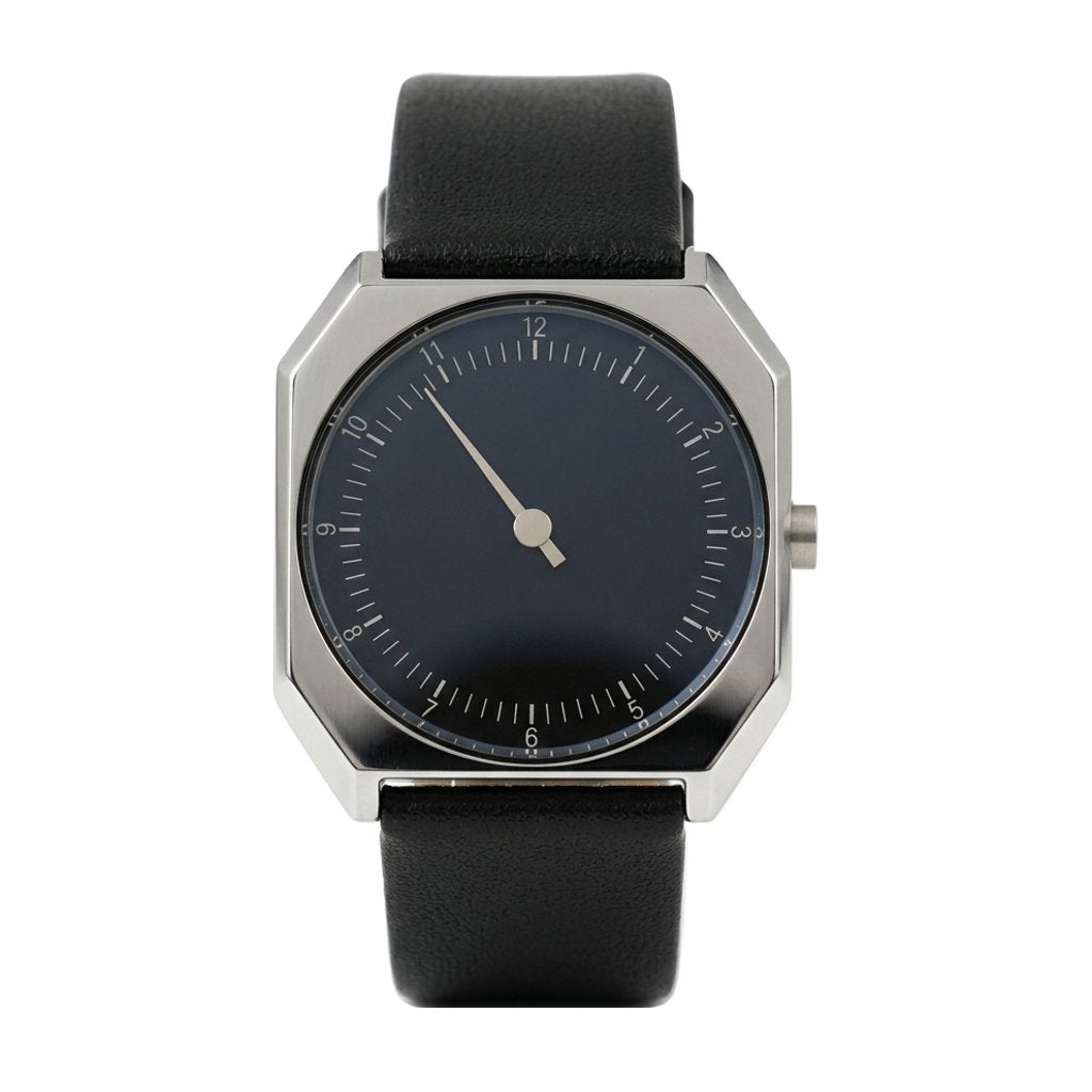 Relógio Masculino Rettrato 38mm Prata, com caixa prateada, mostrador escuro, ponteiro único e pulseira preta fechada, em vista frontal sobre fundo branco.